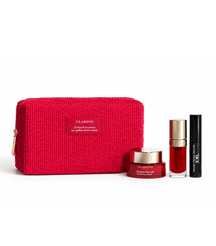 ست هدیه Clarins Instant Smooth و Lip Comfort Oil ست هدیه کلارنس با پرایمر Instant Smooth، روغن لب چری، ریمل XXL و کیف قرمز